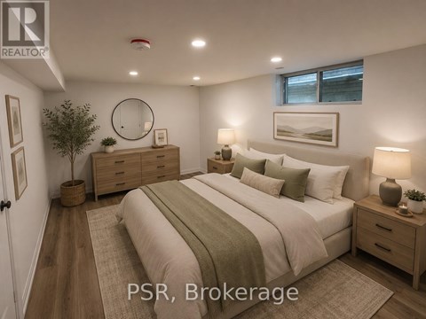 A bedroom with a bed, nightstands, and a plant.
