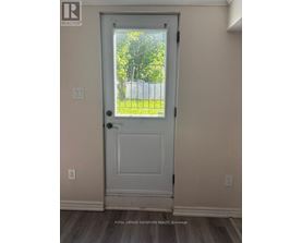 A white door with a glass window in the middle.