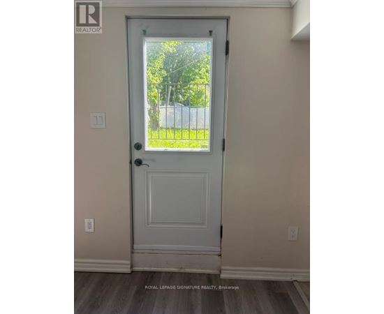A white door with a glass window in the middle.