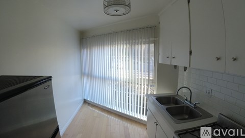 A kitchen with a sink and cabinets.