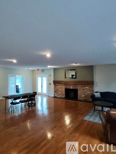 A living room with a fireplace and a couch.