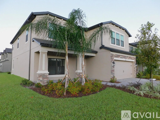 A house with a well-maintained lawn and landscaping.