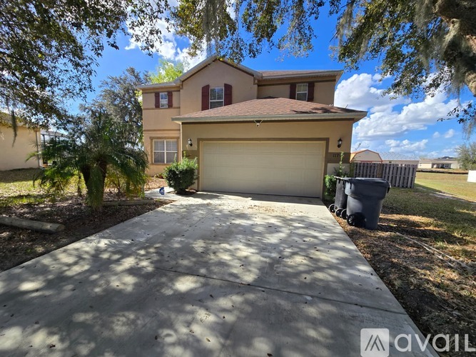 A house with a driveway in front of it is for sale.
