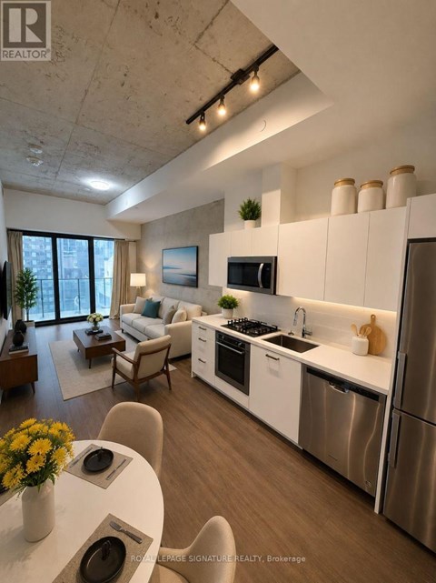 A modern kitchen with white cabinets and stainless steel appliances.