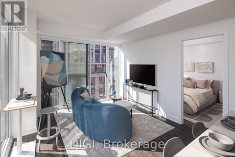 A modern living room with a blue chair and a television.