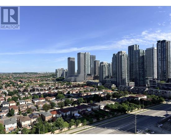 A cityscape with a mix of residential and high-rise buildings.