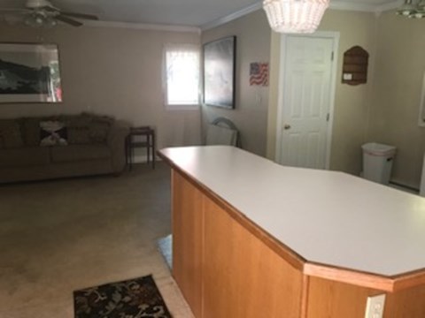 A living room with a couch and a table.
