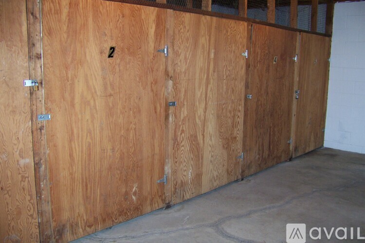 A wall of wooden lockers with the number 2 on the first one.
