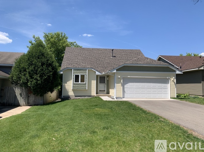 A house with a garage is for sale.