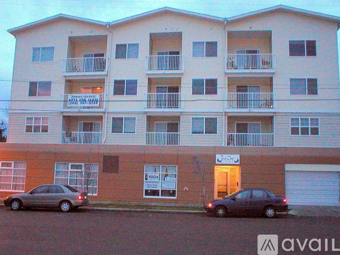 A building with a car parked in front of it.