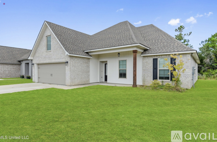 A house with a large front yard is for sale.