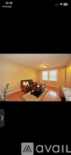 A living room with a couch and a coffee table.