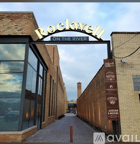 A sign that says "Rockwell on the River" is displayed above a walkway.