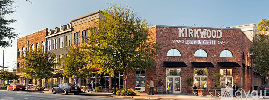 A restaurant named Kirkwood Bar & Grill is located in a brick building.