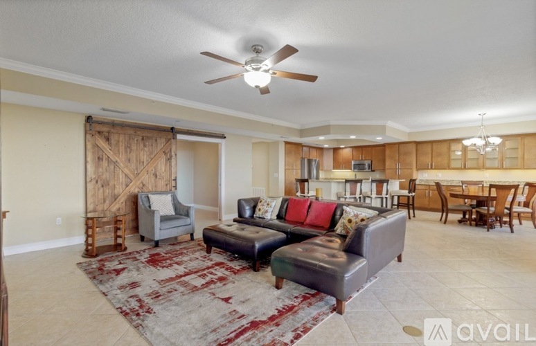 A living room with a rug and a couch.