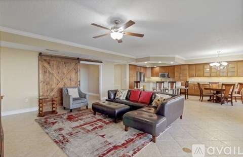 A living room with a rug and a couch.