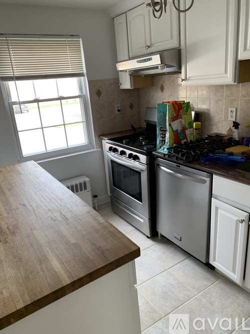 A kitchen with a stove top oven and a microwave.