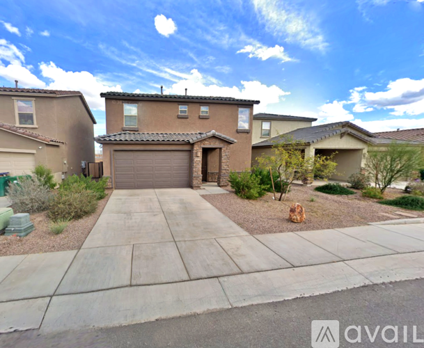 A house with a brown stucco exterior and a garage door is surrounded by a well-maintained front yard.