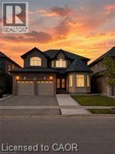 A house with a sunset in the background and the logo of a realtor on the top left.