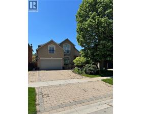 A house with a driveway in front of it.