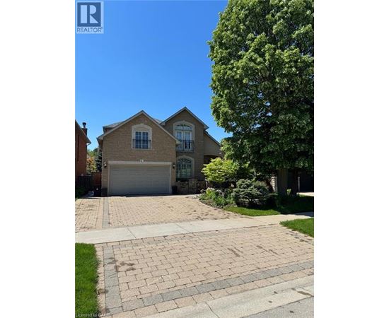 A house with a driveway in front of it.