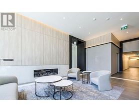 A modern waiting area with a fireplace and comfortable seating.