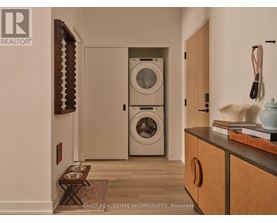 A laundry room with a washer and dryer in it.