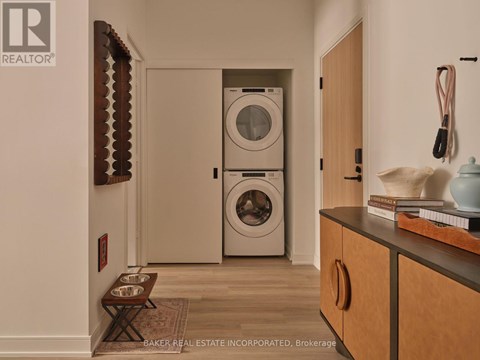 A laundry room with a washer and dryer in it.
