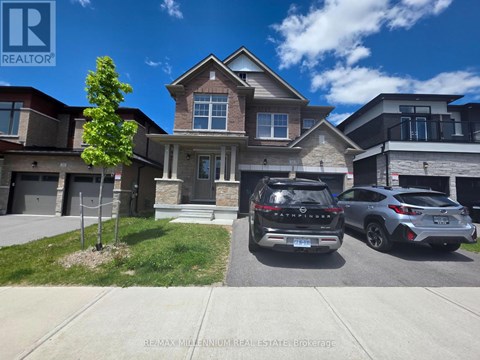 A house with a car and another car parked in front.