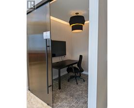 A small room with a desk and a chair.