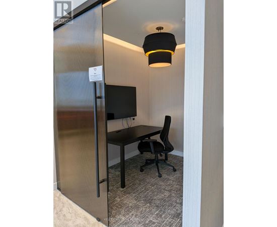 A small room with a desk and a chair.