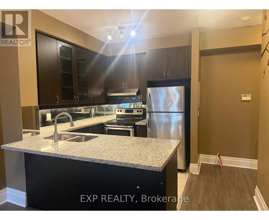 A kitchen with EXP REALTY, Brokerage written on the island.