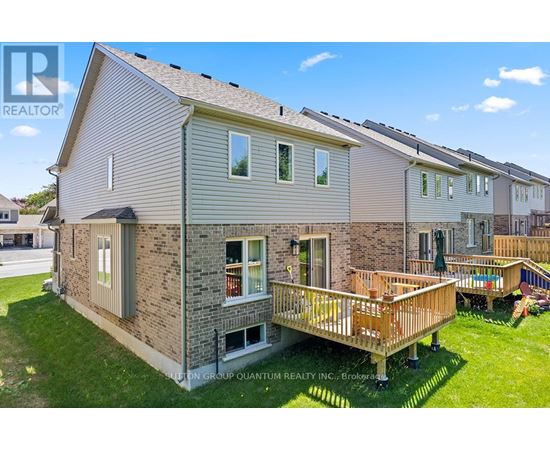 A house with a deck in front of it.