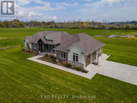 A house with a lawn in front of it is for sale.