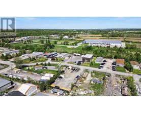 An aerial view of a small town with a large building in the center.