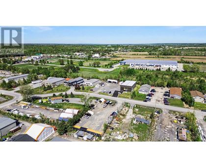 An aerial view of a small town with a large building in the center.