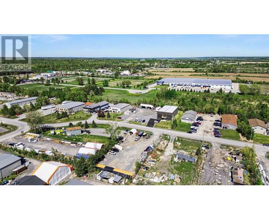 An aerial view of a small town with a large building in the center.