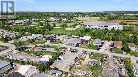 An aerial view of a small town with a large building in the center.