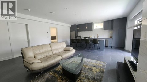 A living room with a couch and a coffee table.