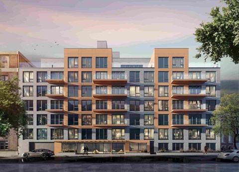 A modern apartment building with multiple balconies and a mix of brown and white exterior colors.