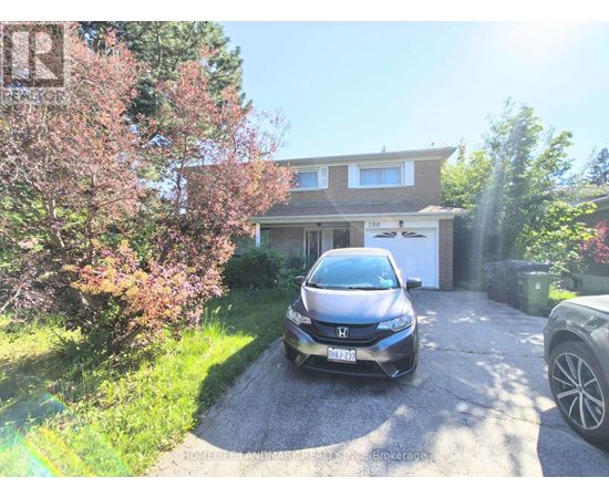 A Honda car is parked in front of a house.