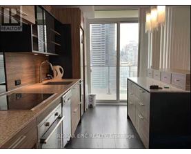 A modern kitchen with a view of the city.