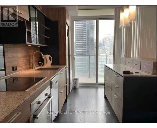 A modern kitchen with a view of the city.
