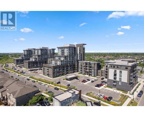 A real estate company logo is displayed on an aerial view of a residential area with modern apartment buildings.