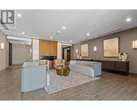 A spacious living room with a fireplace and modern furniture.