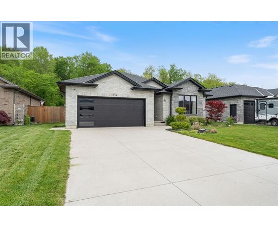 A house with a garage is for sale.