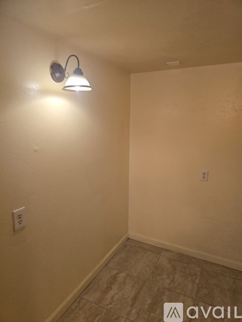 A wall socket is on the wall.