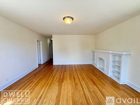 A room with wooden floors and white walls.