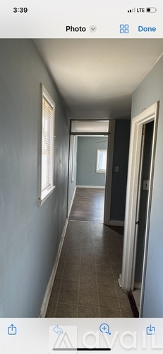 A long hallway with a door at the end.