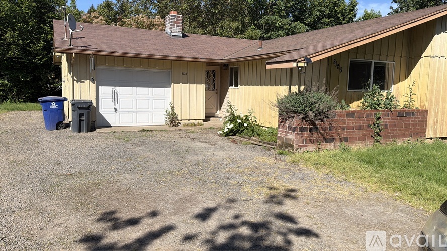 A house with a garage and a driveway.